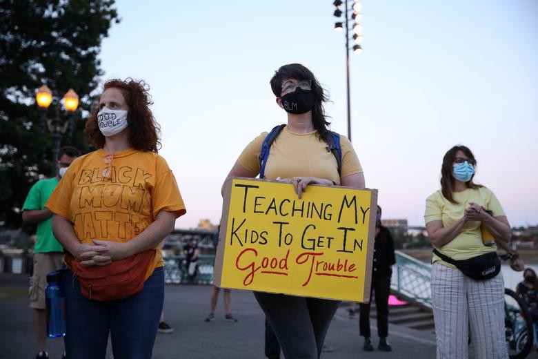 Mothers protest against racial inequality and police violence in Portland, Oregon, July 22, 2020. REUTERS/Caitlin Ochs